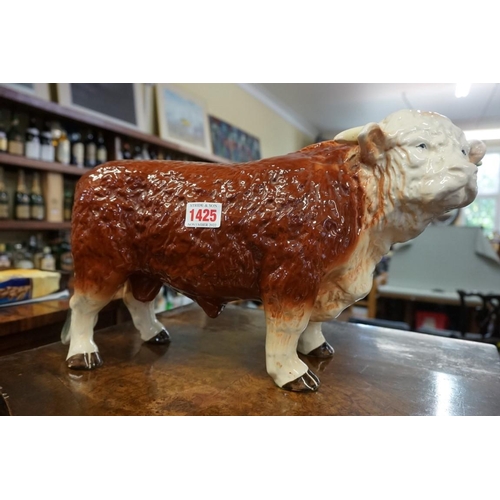 1425 - A Melba ware Hereford bull, 41cm long; together with a Sylvac bull, 36cm long. ... 