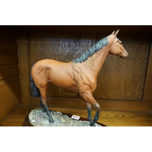 1426 - A Royal Doulton figure of Red Rum, DA218, on wood stand. 