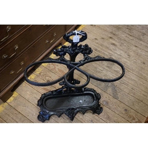 1438 - A cast iron stick stand and liner, 69.5cm high.