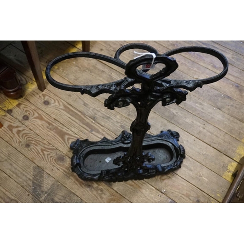 1438 - A cast iron stick stand and liner, 69.5cm high.