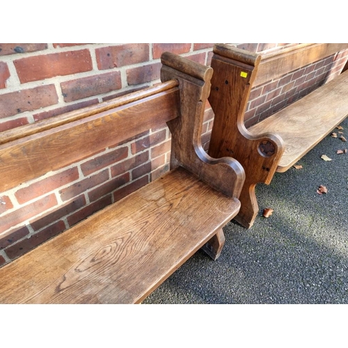 1450 - A large oak and elm pew, 229cm wide.