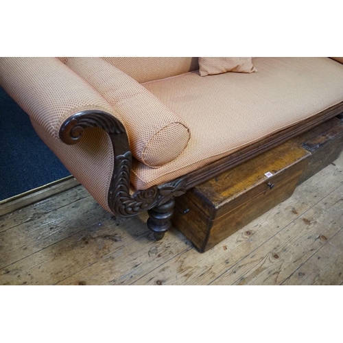 1461 - A William IV carved mahogany scroll arm settee, 211cm wide.