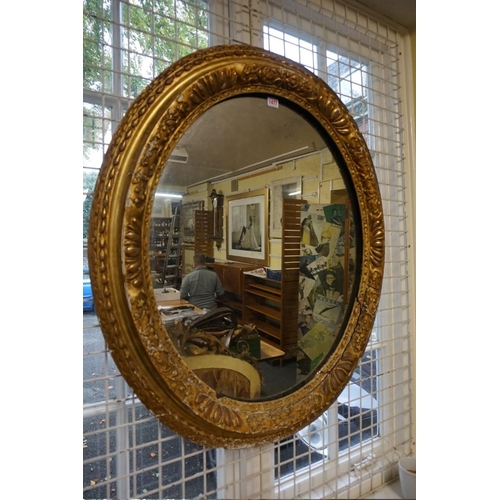 1477 - An 18th century gilt framed oval wall mirror, 95 x 81cm.