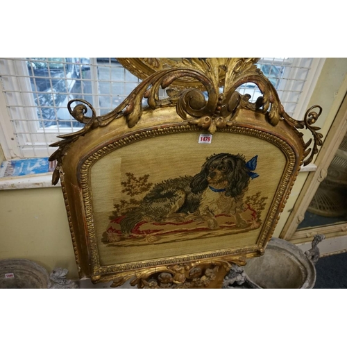 1479 - A 19th century gilt framed tripod firescreen, with embroidered panel of spaniel, 127cm high.... 