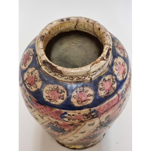 1516 - An early middle eastern glazed pottery vase, 20cm high, (restoration).