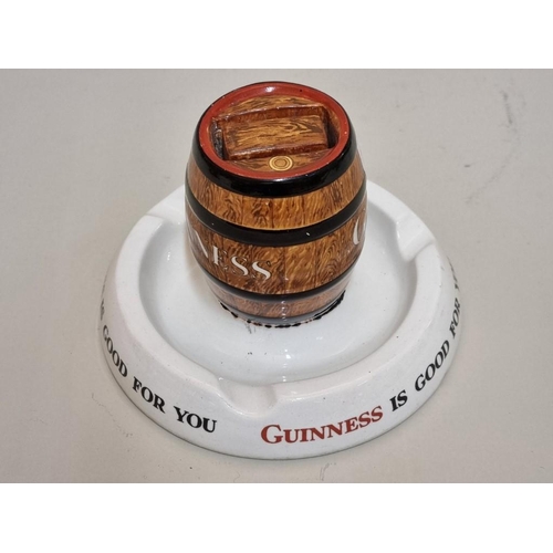 1520 - A Mintons 'Guinness' combined ashtray and matchbox stand, 14cm diameter, (repaired).... 