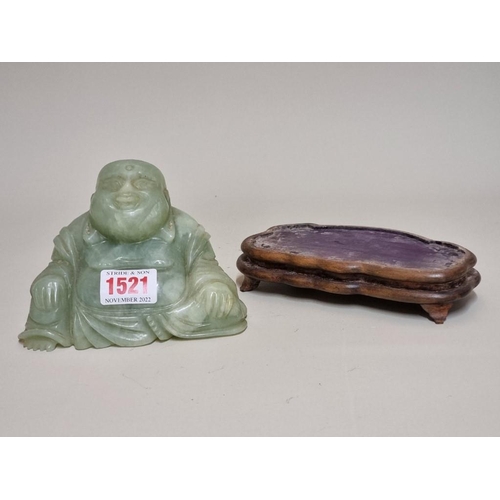 1521 - A Chinese carved green jade Buddha, on fitted wood stand, 11cm high.