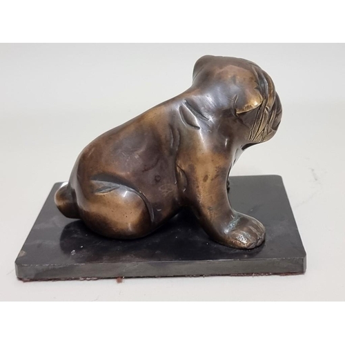 1525 - A bronze seated British bulldog, on rectangular slate base, 15cm wide.