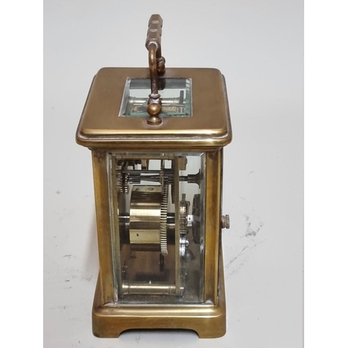 1549 - An antique brass carriage timepiece, height including handle 14.5cm. 