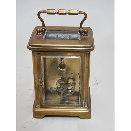 1549 - An antique brass carriage timepiece, height including handle 14.5cm. 