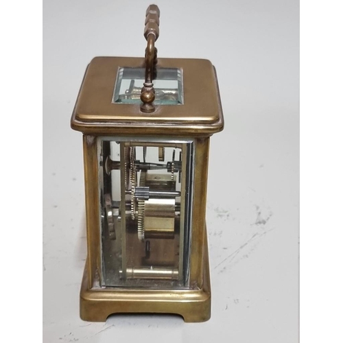 1549 - An antique brass carriage timepiece, height including handle 14.5cm. 