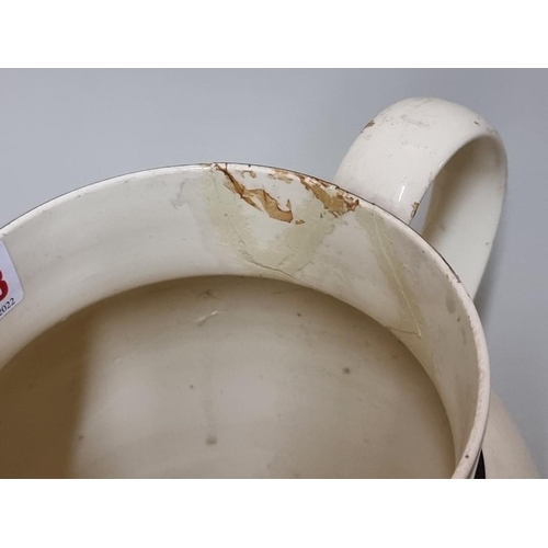 1553 - A late 18th century creamware masonic jug, printed with the cast iron bridge at Sunderland and with ... 