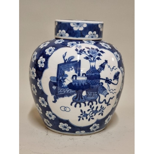 1560 - A large Chinese blue and white jar and cover, Kangxi six character mark to base, 25.5cm high.... 