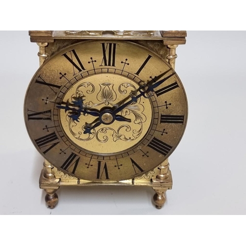 1585 - A brass lantern style carriage clock, 27cm high. 