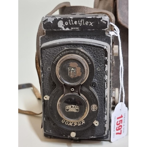 1597 - Cameras: a Rolleiflex, with original leather case. 