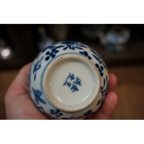 1601 - A Chinese blue and white bottle vase, painted with a phoenix, 23.5cm high; together with four others... 