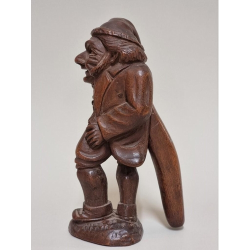 1627 - A good late 19th century Black Forest carved wood novelty figural nutcracker, 17.5cm high. ... 