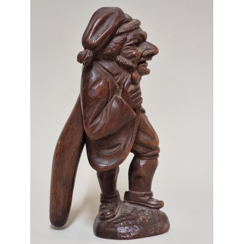 1627 - A good late 19th century Black Forest carved wood novelty figural nutcracker, 17.5cm high. ... 