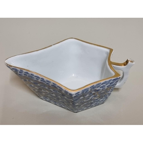 1630 - An interesting Chinese blue and white sauce boat, with gilt clobbered decoration, 11.5cm long.&... 