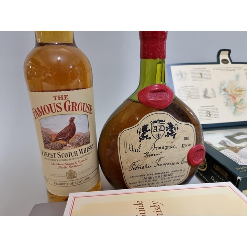 125 - A 70cl bottle of Dauriac Vieil Armagnac; together with a set of six 5cl 'Classic Malts', in oc; a 70... 