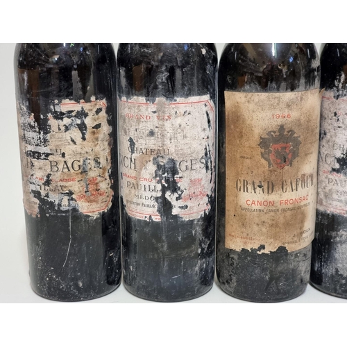 128 - Four 73cl bottles of Chateau Lynch Bages, Pauillac, 1973; together with a bottle of Grand Cafour Can... 