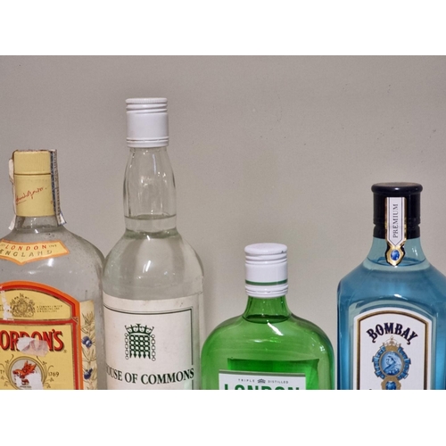 133 - Four bottles of gin, comprising: a 1 litre Gordon's; a 70cl Bombay Sapphire; a 70cl House of Commons... 