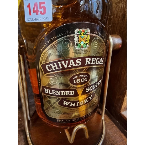 145 - An old 1.5 litre bottle of Chivas Regal 12 year old blended whisky, in cradle and presentation ... 