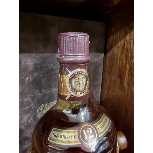 145 - An old 1.5 litre bottle of Chivas Regal 12 year old blended whisky, in cradle and presentation ... 