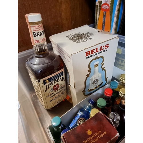 150 - A mixed lot of alcohol, to include: an old 1 litre bottle of Jim Beam Bourbon; a 75cl bottle of Meta... 