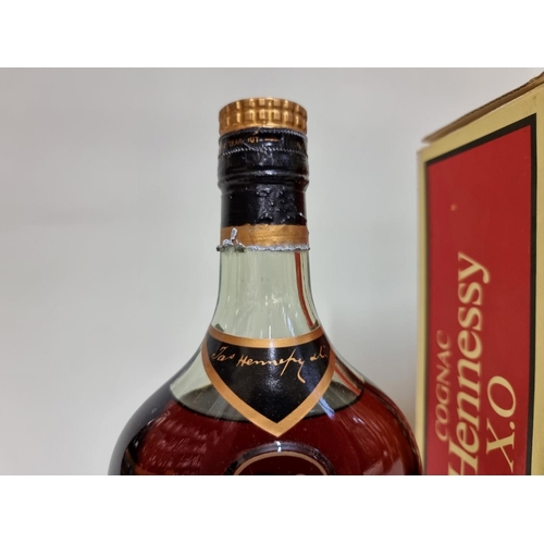 16 - A 24 fl.oz. bottle of Hennessy XO cognac, 1960s/70s bottling, in card box.