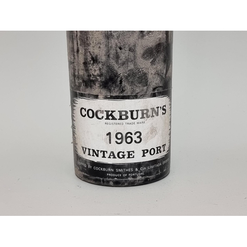 96 - A bottle of Cockburn's 1963 vintage port.