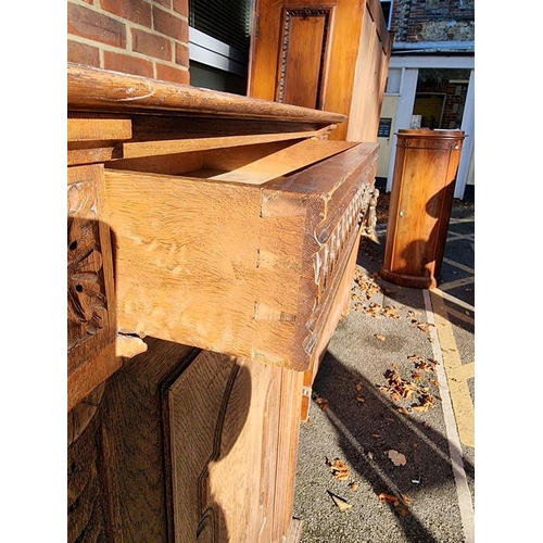 1157 - A Continental carved oak cupboard, 91cm wide. 