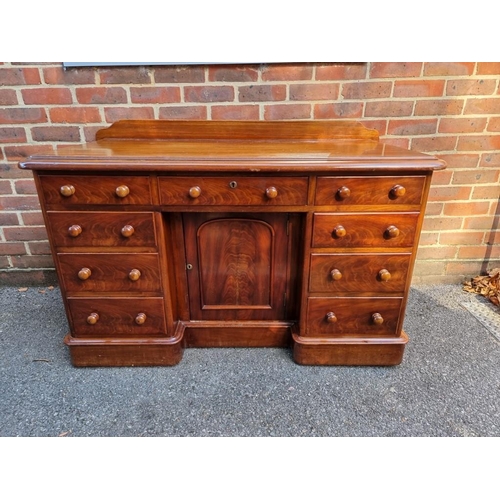 1159 - A Victorian mahogany pedestal desk, with kneehole cupboard, 122cm wide. 