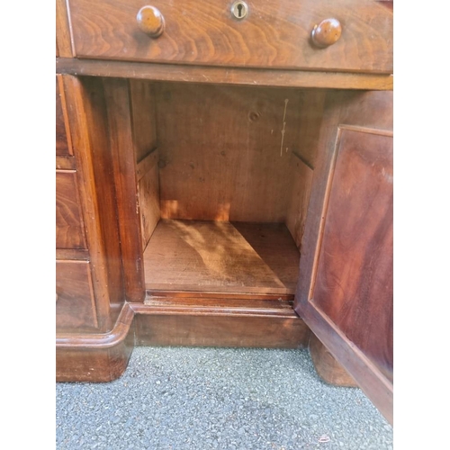 1159 - A Victorian mahogany pedestal desk, with kneehole cupboard, 122cm wide. 