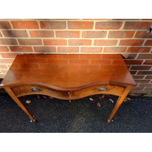 1407 - An antique mahogany serpentine fronted side table, the frieze drawer with ivory escutcheon, 101cm wi... 