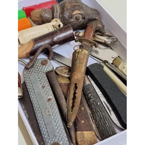 1649 - A small collection of vintage knives and whistles, together with a novelty carved wood otter's head ... 