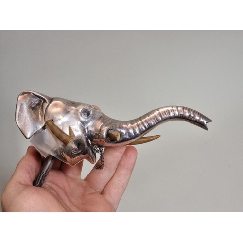 1652 - An electroplated novelty elephant's head funnel or spout, 15.5cm long, (s.d. to one tusk).... 