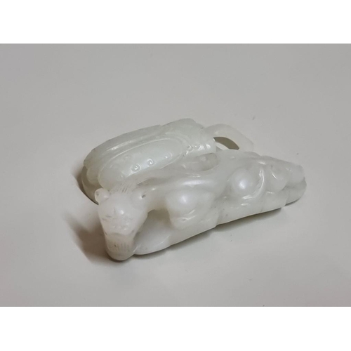 1657 - A good Chinese carved pale celadon jade beetle buckle, 5.7cm long; together with a Chinese carved pa... 