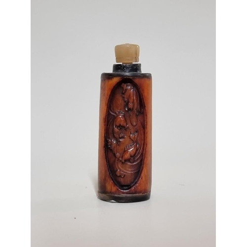 1658 - A Chinese carved horn snuff bottle and stopper, total height 7.7cm.