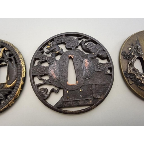 1660 - Four interesting Japanese tsubas, comprising a bronze example, with gilt detail, 7.5 x 6.9cm; two st... 