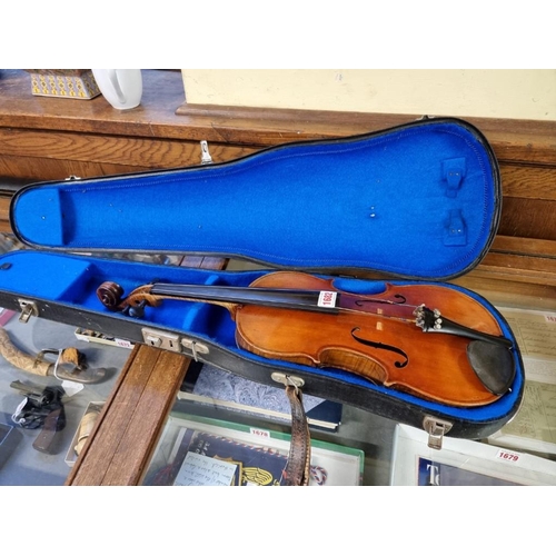 1682 - An antique Continental violin, possibly French, with 14in one piece back, in padded case. ... 