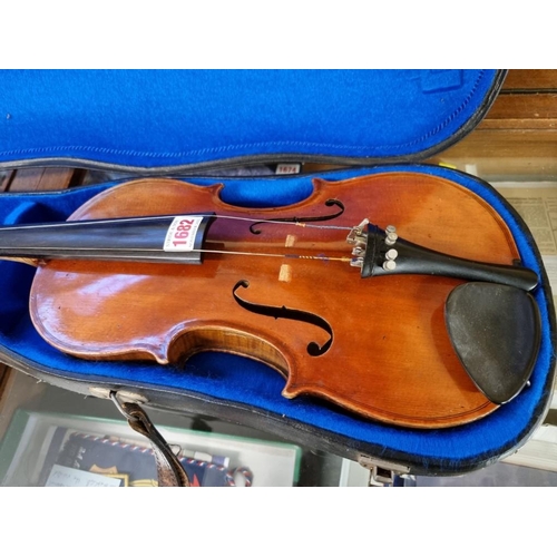 1682 - An antique Continental violin, possibly French, with 14in one piece back, in padded case. ... 