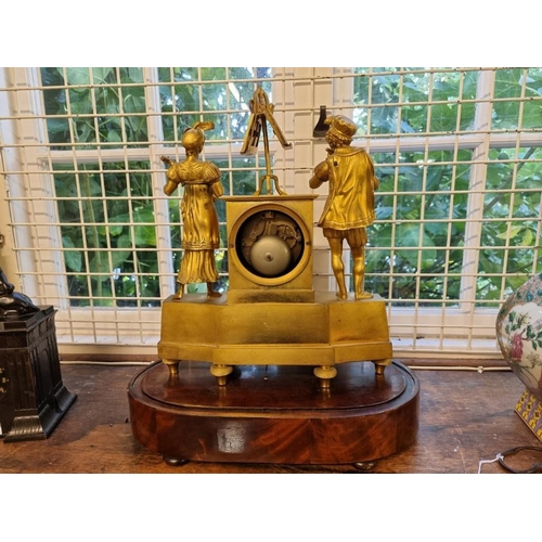 1689 - A rare 19th century French gilt bronze figural musical mantel clock, the mahogany base with 6in cyli... 