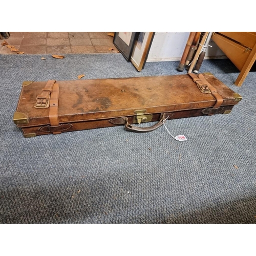 1749 - An old leather and brass bound shotgun case, labelled Charles Boswell. 