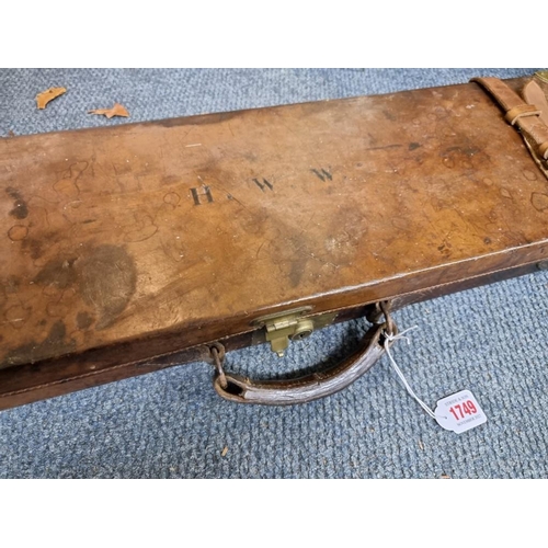 1749 - An old leather and brass bound shotgun case, labelled Charles Boswell. 