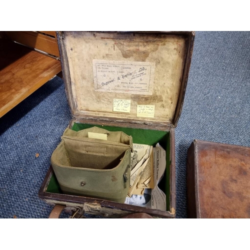 1751 - An old canvas and leather cartridge case, labelled Cogswell & Harrison; together with a Wor... 