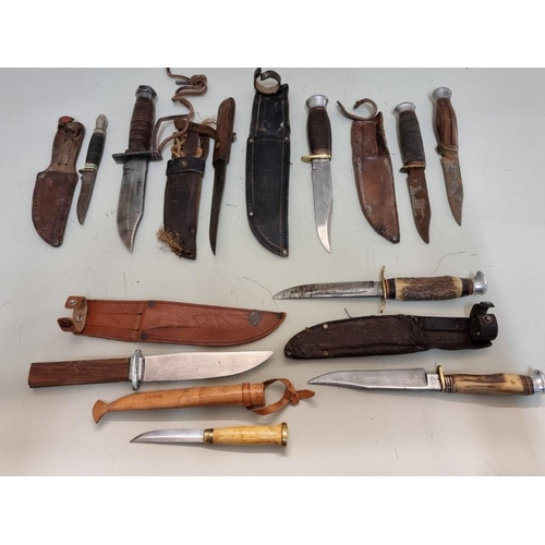 1761 - A small collection of knives and sheaths.