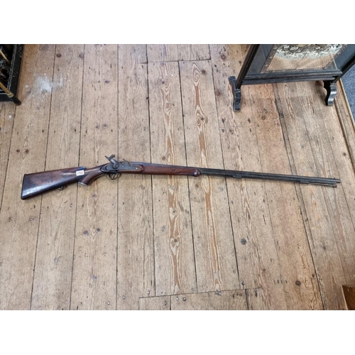 1762 - A 19th century percussion musket, having 97cm barrel stamped 'M.R., RTM, VI, 163, 65'.... 