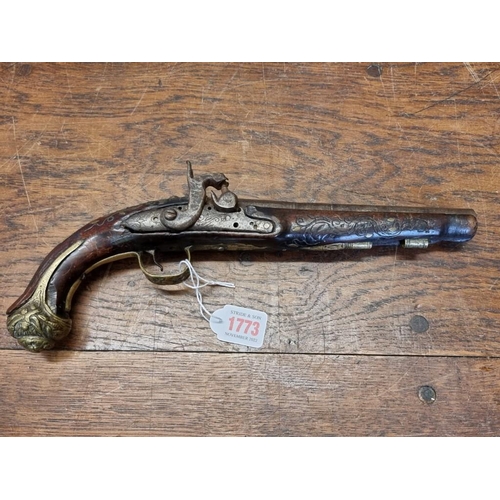 1773 - A 19th century Continental percussion pistol, with brass inlay.