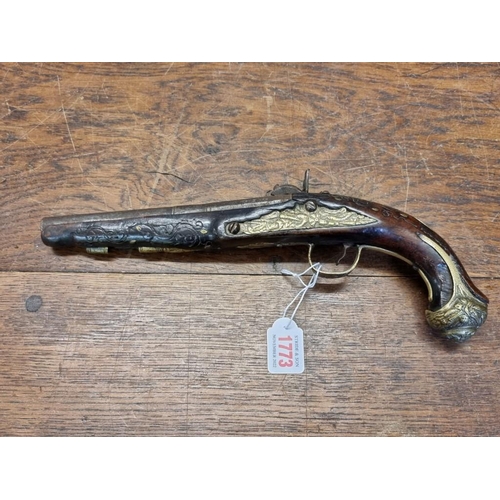 1773 - A 19th century Continental percussion pistol, with brass inlay.